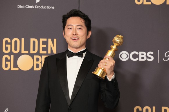 epa11063395 US actor Steven Yeun poses with the award for Best Performance by a Male Actor in a Limited Series, Anthology Series or a Motion Picture Made for Television for &#039;Beef&#039; in the pre ...