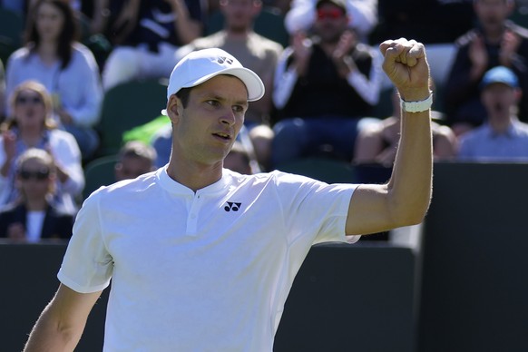 Poland's Hubert Hurkacz celebrates winning a point against Spain's Alejandro Davidovich Fokina during their men's singles tennis match on day one of the Wimbledon tennis championships in London, Monday, June 27, 2022. (AP Photo/Alastair Grant)