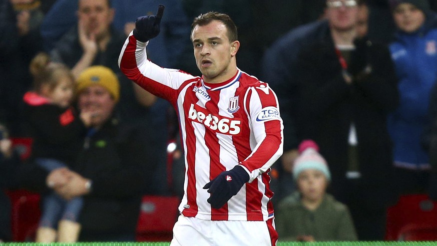 Stoke City&#039;s Xherdan Shaqiri celebrates scoring his side&#039;s first goal of the game against Swansea during the English Premier League soccer match at the Bet35 Stadium, Stoke, England, Saturda ...