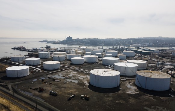 epa09815080 A picture taken with a drone shows a tank terminal that handles storage of crude and refined petroleum, or crude oil, as well as other bulk industrial liquids, in Bayonne, New Jersey, USA, ...