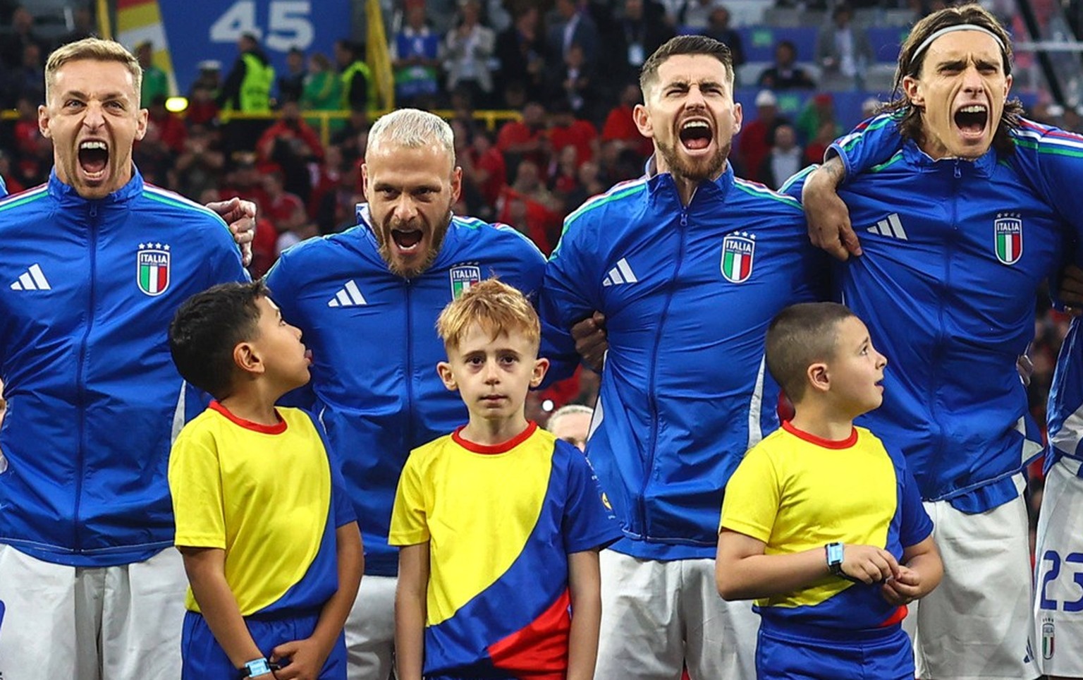 Italy v Albania 15 June 2024, Dortmund - UEFA EUROs - Group B - Italy v Albania - The mascots look up as the Italy players sing their national anthem enthusiastically - Photo: Charlotte Wilson / Offsi ...