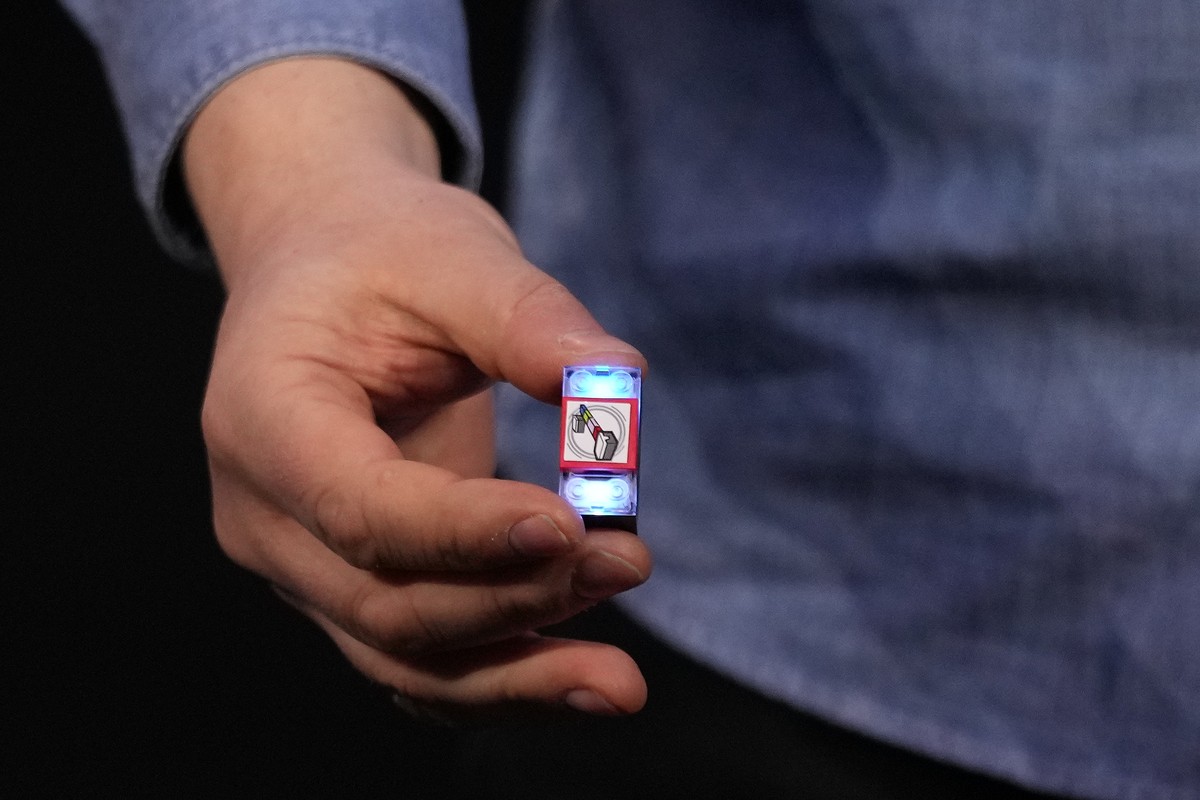 A LEGO smart brick is held during a LEGO news conference ahead of the CES tech show Monday, Jan. 5, 2026, in Las Vegas. (AP Photo/Abbie Parr)
Gadget Show LEGO