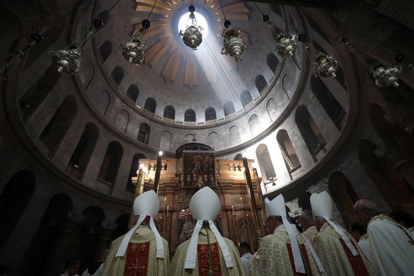 epa07513527 Christian worshippers take part in the procession of the holy Thursday, during the Catholic Washing of the Feet ceremony on Easter Holy Week, at the Church of the Holy Sepulcher in Jerusal ...