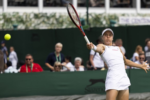 Viktorija Golubic of Switzerland in action during the first round ladies doubles match against Sonay Kartal and Nell Miller of Great Britain, at the All England Lawn Tennis Championships in Wimbledon, ...