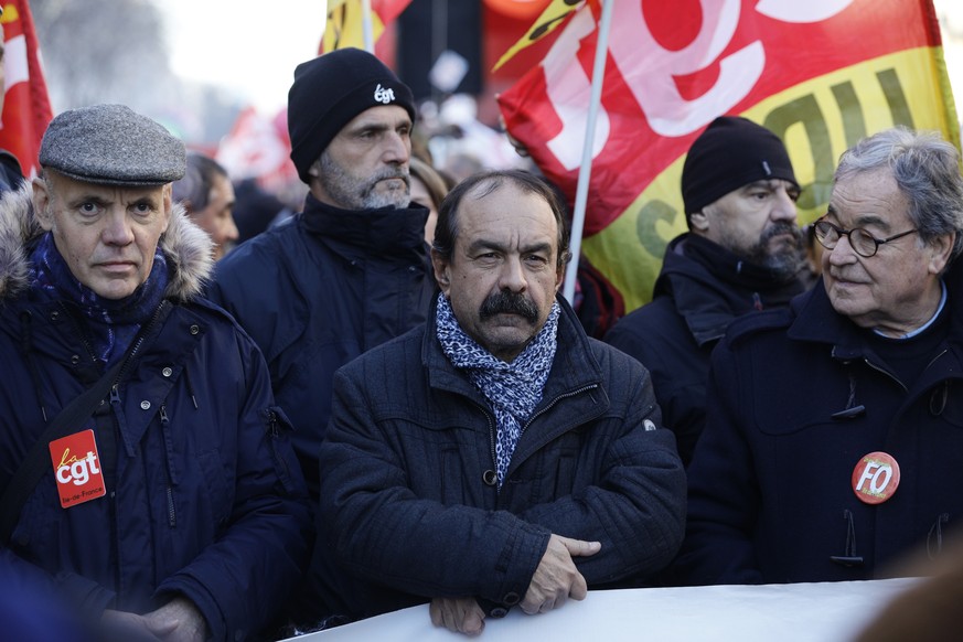 CGT union leader Philippe Martinez, center, attends a demonstration Thursday, Jan. 16, 2020 in Paris. Protesters denounce French President Emmanuel Macron&#039;s plans to overhaul the pension system.  ...