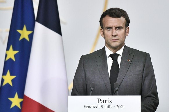 epa09333689 French President Emmanuel Macron reacts during a joint press conference with Niger&#039;s President at the Elysee presidential Palace, in Paris, France, 09 July 2021, following a video sum ...