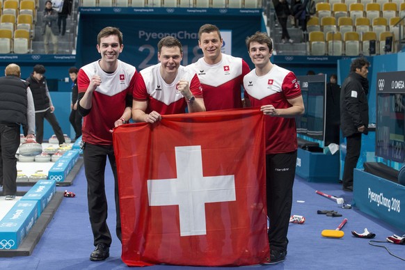 Peter de Cruz, Claudio Paetz, Valentin Tanner and Benoit Schwarz of Switzerland, from left, celebrate after winning the Curling Bronze Medal game of the men between Switzerland and Canada at the XXIII Winter Olympics 2018 in Gangneung, South Korea, on Friday, February 23, 2018. (KEYSTONE/Alexandra Wey)