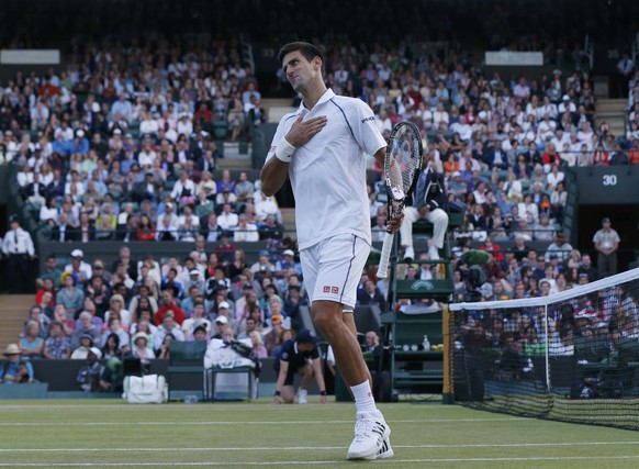 Novak Djokovic of Serbia reacts after missing a shot during his match against Kevin Anderson of South Africa at the Wimbledon Tennis Championships in London, July 6, 2015. REUTERS/Suzanne Plunkett