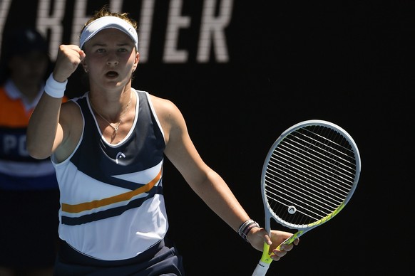 Barbora Krejcikova of the Czech Republic celebrates after defeating Jelena Ostapenko of Latvia in their third round match at the Australian Open tennis championships in Melbourne, Australia, Friday, J ...