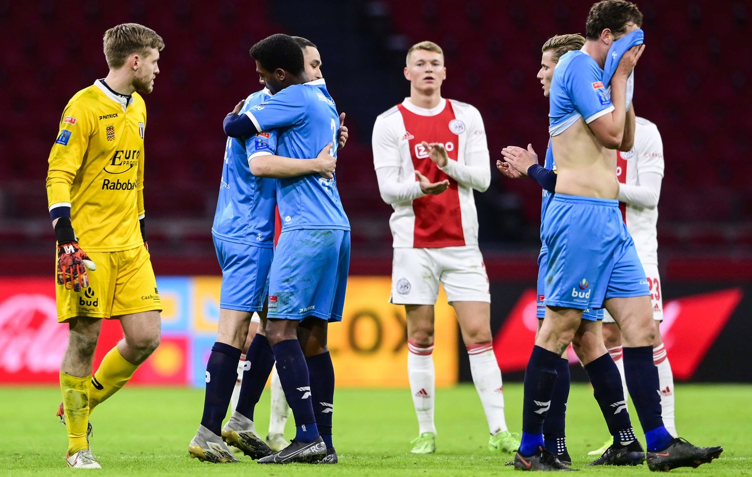 epa09705219 Devin Plank (2-L) of Excelsior Maassluis enters the field during the Toto KNVB Cup match between Ajax Amsterdam and Excelsior Maassluis at the Johan Cruijff ArenA in Amsterdam, Netherlands ...