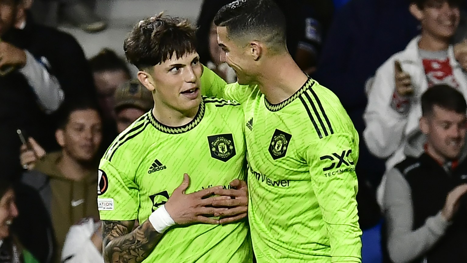 Manchester United&#039;s Alejandro Garnacho, left, celebrates with teammate Cristiano Ronaldo after scoring his side&#039;s first goal during the Europa League Group E soccer match between Real Socied ...