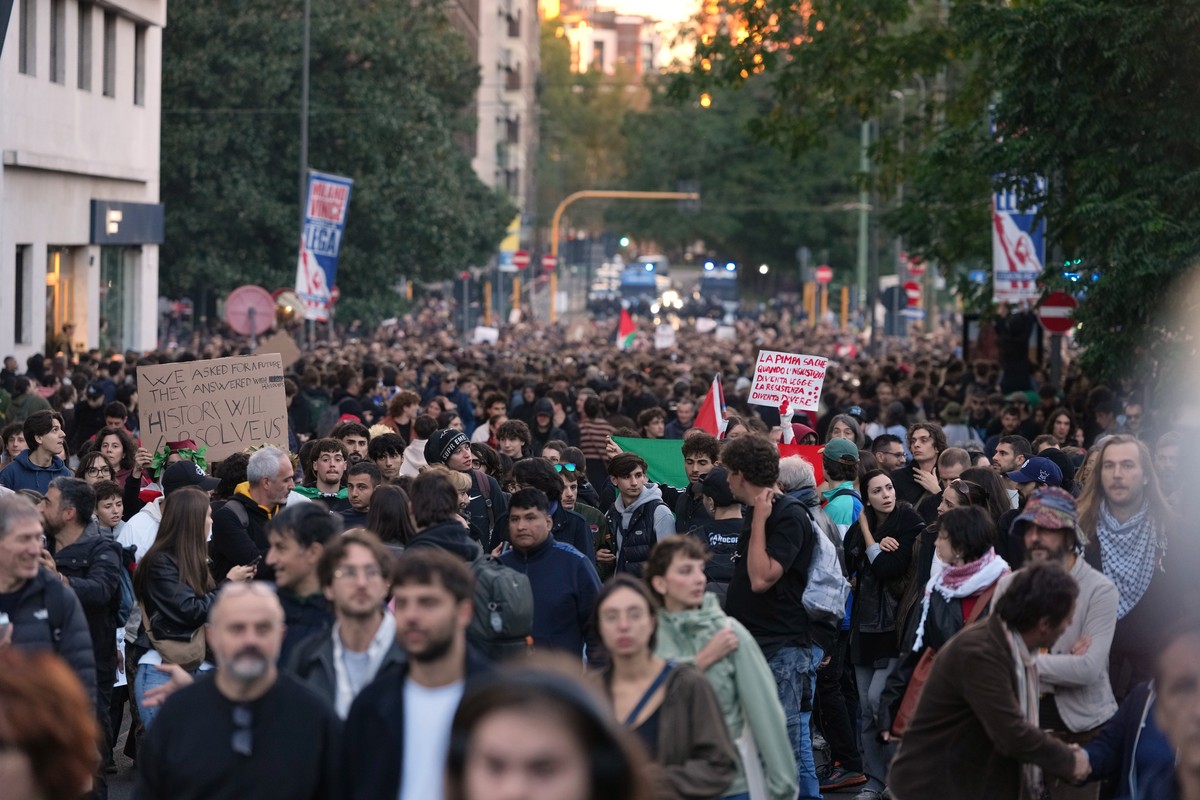 People march through the streets of Milan, Saturday, Oct. 24, 2026, to protest against the rising cost of living and deteriorating public services during one of several protests in Italy organized by  ...