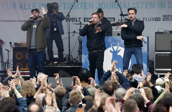 epa05942365 German hip-hop group &#039;Antilopen Gang&#039; performs during a concert evening called &#039;To the Press&#039; in support of jailed German-Turkish journalist Deniz Yucel and imprisoned  ...