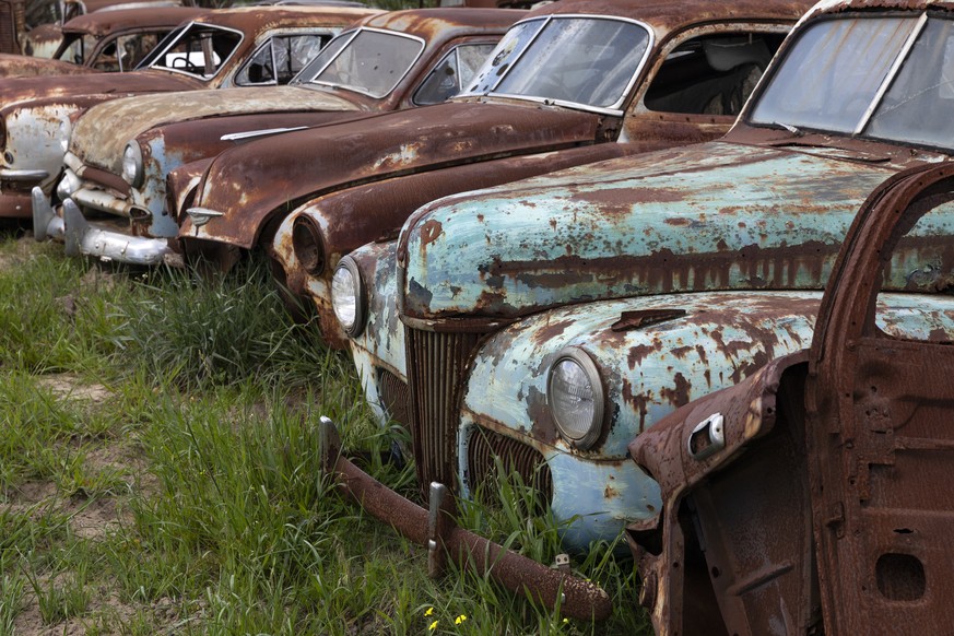 epa07799275 A general view of a classic car graveyard at the Wijnland Auto Museum in Cape Town, South Africa, 28 August 2019. Les Boshoff the owner of the Wijnland Auto Museum founded the business 30  ...