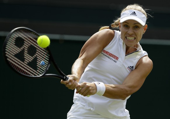 Angelique Kerber of Germany returns the ball to Belinda Bencic of Switzerland during their women&#039;s singles match on the seventh day at the Wimbledon Tennis Championships in London, Monday July 9, ...