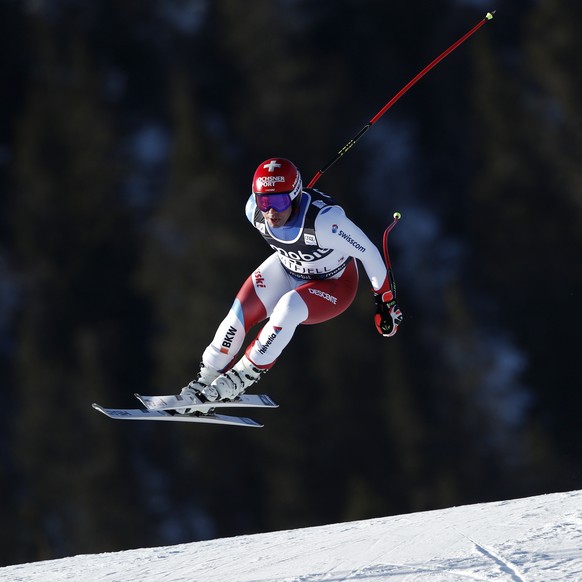 Switzerland&#039;s Beat Feuz speeds down the course during an alpine ski, men&#039;s World Cup downhill in Kvitfjell, Norway, Friday, March 4, 2022. (AP Photo/Gabriele Facciotti)