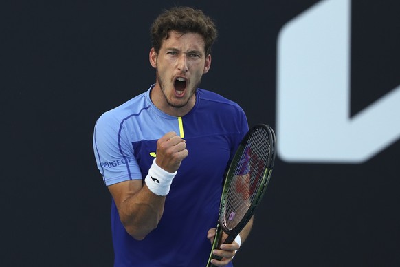 Pablo Carreno Busta of Spain reacts after winning a point against Sebastian Korda of the U.S. during their third round match at the Australian Open tennis championships in Melbourne, Australia, Friday ...