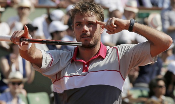 Stan Wawrinka of Switzerland celebrates after defeating Jo-Wilfried Tsonga of France during their men&#039;s semi-final match at the French Open tennis tournament at the Roland Garros stadium in Paris ...