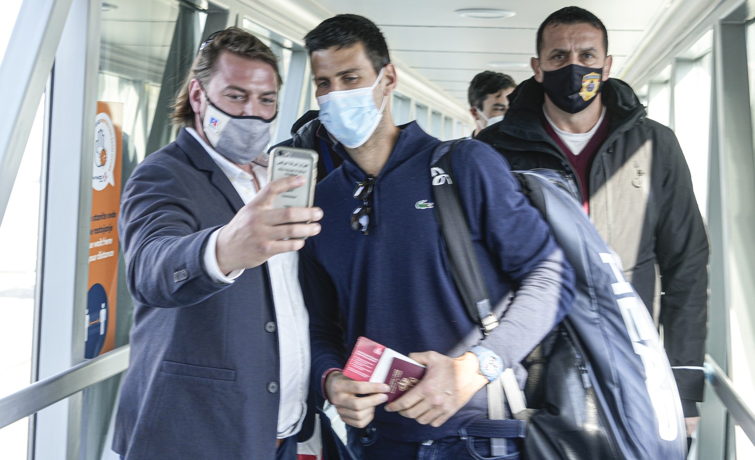 A man takes a selfie photograph with Serbian tennis player Novak Djokovic after his arrival in Belgrade, Serbia, Monday, Jan. 17, 2022. Djokovic arrived in the Serbian capital following his deportatio ...