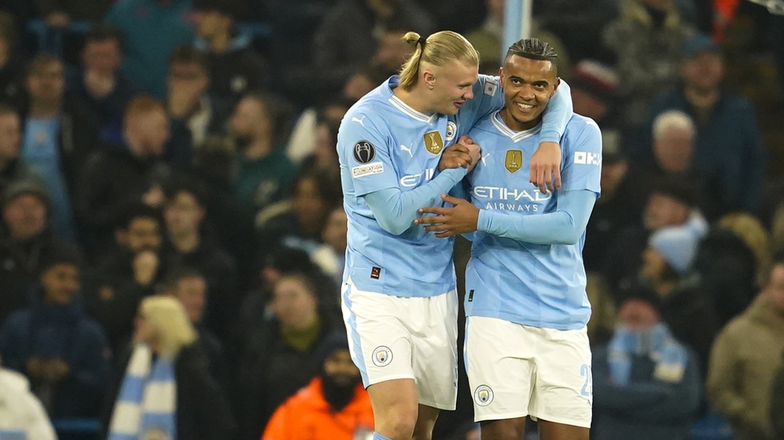 Manchester City&#039;s Manuel Akanji, right, celebrates with his teammate Erling Haaland after he scored his side&#039;s first goalduring a Champions League round of sixteen second leg soccer match be ...
