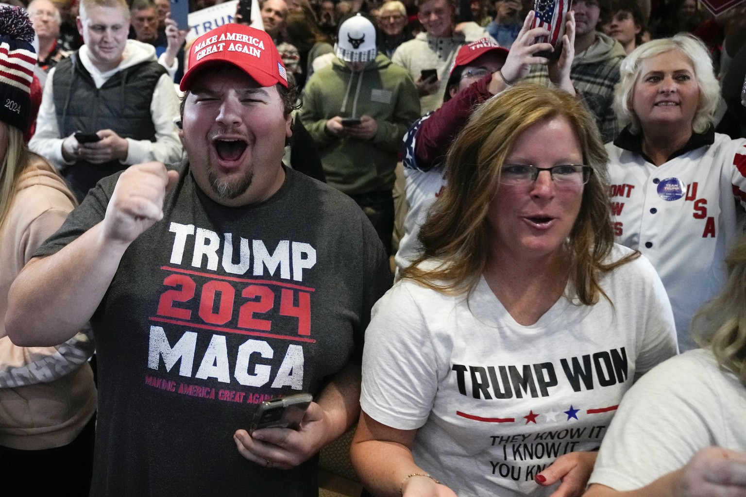 People cheer as former President Donald Trump arrives to speak at a campaign rally at Terrace View Event Center in Sioux Center, Iowa, Friday, Jan. 5, 2024. (AP Photo/Andrew Harnik)