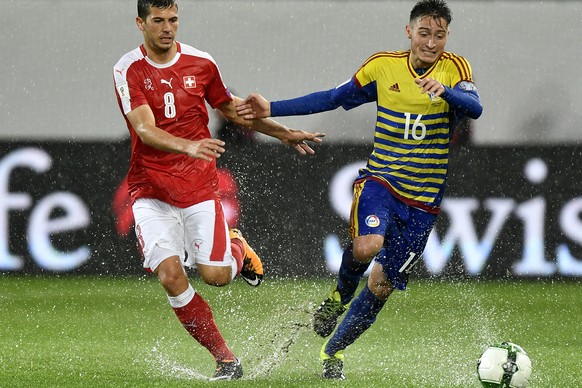 Swiss Remo Freuler, left, fights for the ball against Andorra&#039;s Cristian Martinez, right, during the 2018 Fifa World Cup Russia group B qualification soccer match between Switzerland and Andorra  ...