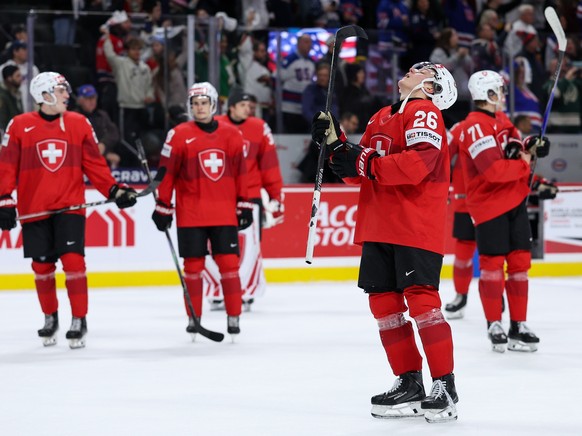 Switzerland defenseman Ludvig Johnson (26) reacts after his team's loss in an IIHF World Junior Hockey Championship game against the United States, Saturday, Dec. 27, 2025, in St. Paul, Minn. (AP ...