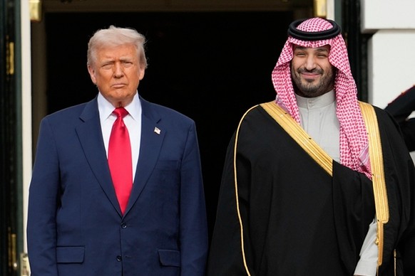 FILE - President Donald Trump stands with Saudi Arabia's Crown Prince Mohammed bin Salman on his visit to the White House, Nov. 18, 2025, in Washington. (AP Photo/Mark Schiefelbein, File)
Donald  ...