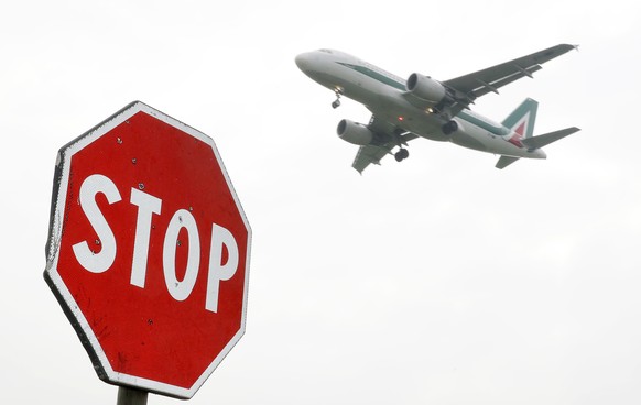 FILE - In this Monday, March 20, 2017 file photo, an Alitalia plane comes in for landing at Linate Airport, in Milan, Italy. The new airline being created to replace long financially-ailing Alitalia w ...