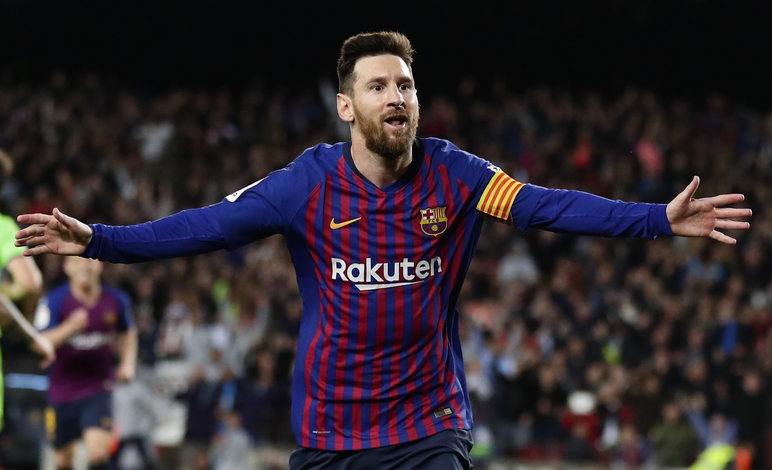 Barcelona forward Lionel Messi celebrates after scoring his side's opening goal during a Spanish La Liga soccer match between FC Barcelona and Levante at the Camp Nou stadium in Barcelona, Spain, Satu ...