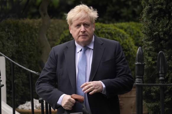 FILE - Boris Johnson leaves his house in London, on March 22, 2023. Several dozen allies of former British Prime Minister Boris Johnson received honors from King Charles III on Friday June 9, 2023, a ...