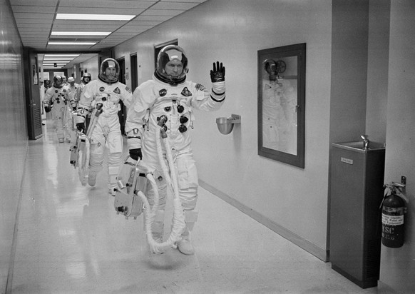 FILE - In this Dec. 21, 1968, file photo made available by NASA, Apollo 8 Commander Col. Frank Borman leads the way as he, and fellow astronauts Command Module Pilot Capt. James A Lovell Jr., and Luna ...