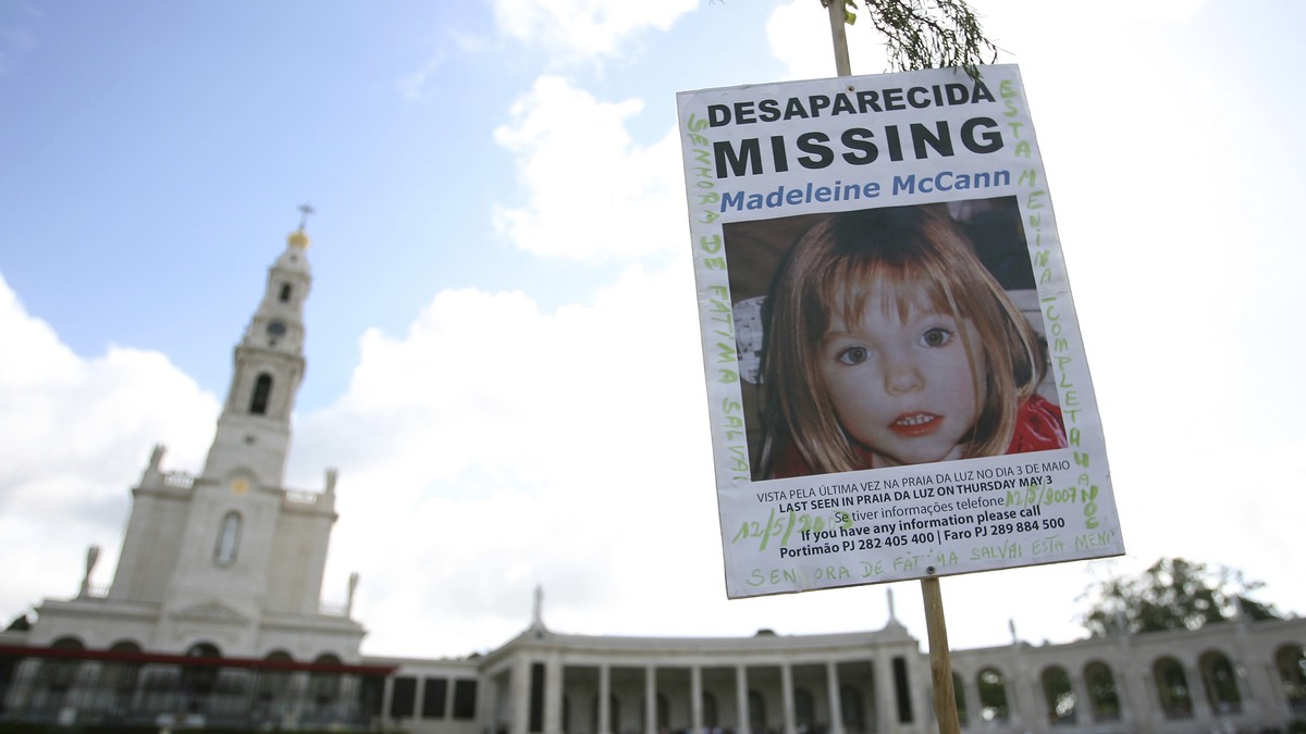 FILE - A picture of missing British girl Madeleine McCann, who disapeared from the Praia da Luz beach resort in the Algarve, is displayed at Our Lady of Fatima shrine Sunday, May 13 2007, in Fatima, n ...