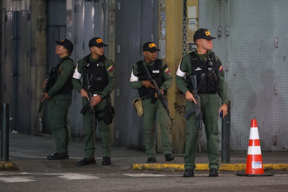 epa12622503 Military personnel guard the perimeter of the Miraflores Presidential Palace in Caracas, Venezuela, 03 January 2026, after multiple explosions were reported across the capital. US Presiden ...