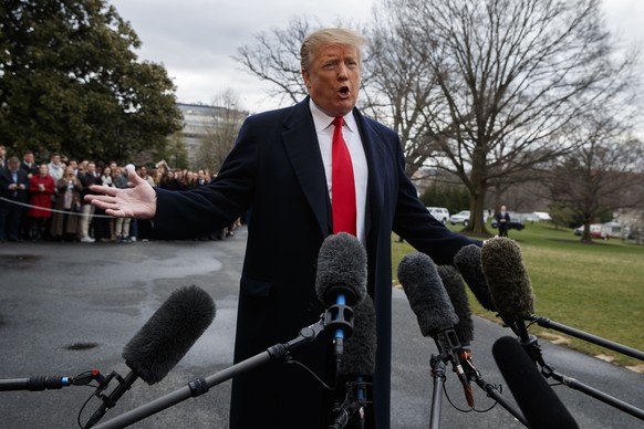 President Donald Trump talks with reporters before boarding Marine One on the South Lawn of the White House, Friday, March 22, 2019, in Washington. Special counsel Robert Mueller on Friday turned over ...