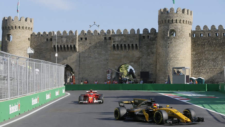 epa06045878 German Formula One driver Nico Hulkenberg of Renault (front) and Finnish Formula One driver Kimi Raikkonen of Scuderia Ferrari in action during the second practice session of the Formula O ...