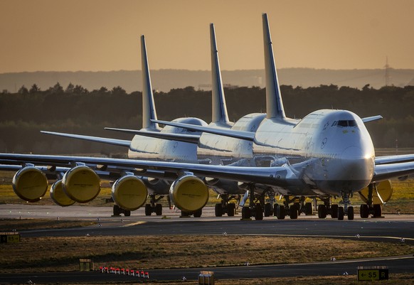 Boeing 747 aircrafts of German Lufthansa are parked at the airport in Frankfurt, Germany, Monday, April 20, 2020. Due to the coronavirus Lufthansa had to cancel 97 percent of its flights. (AP Photo/Mi ...