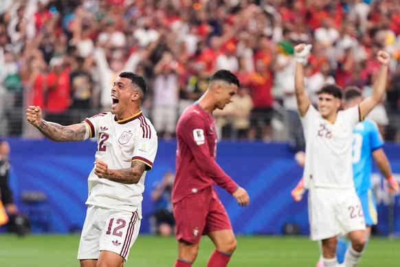 Spain's Pedro Porro (12), Pau Cubarsi (22) and Portugal's Cristiano Ronaldo react after Spain defeated Portugal in the World Cup round of 16 soccer match in Arlington, Texas, near Dallas, Mo ...