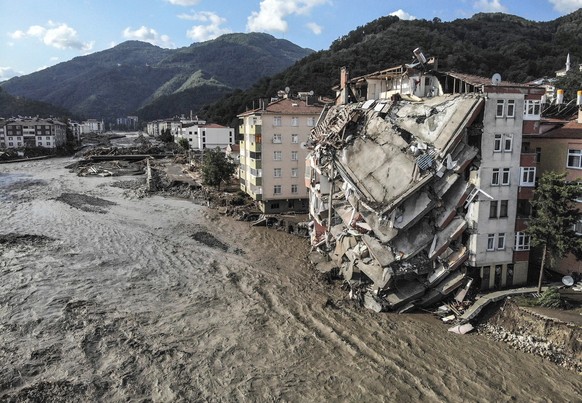 An aerial photo shows destroyed buildings after floods and mudslides killed about two dozens of people, in Bozkurt town of Kastamonu province, Friday, Aug. 13, 2021. Heavy rainfalls that pounded the B ...