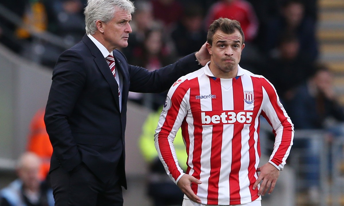 Britain Soccer Football - Hull City v Stoke City - Premier League - The Kingston Communications Stadium - 22/10/16
Stoke City manager Mark Hughes with Stoke City's Xherdan Shaqiri 
Reuters / Sc ...