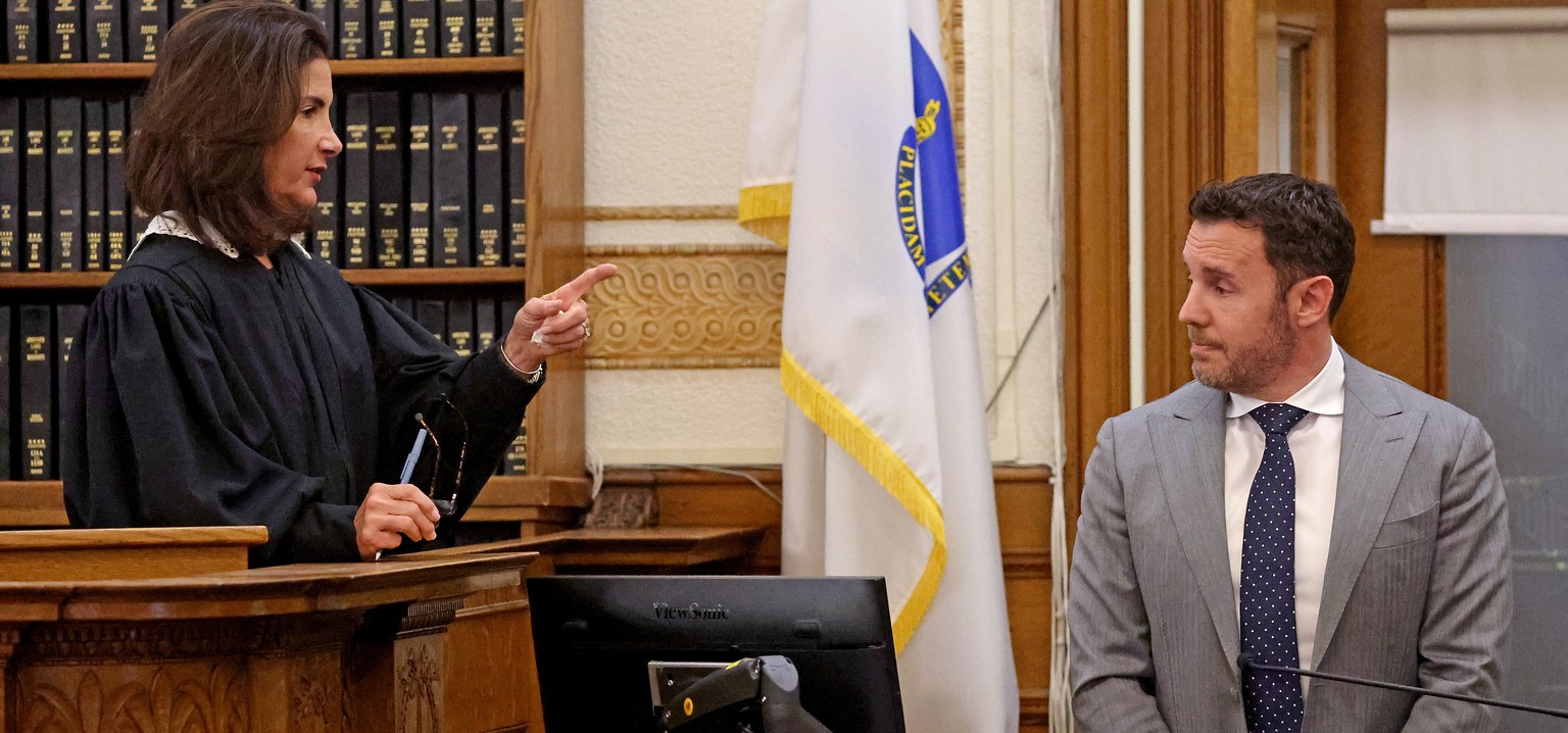 William Fastow listens as Judge Diane Freniere addresses him while he testifies during the murder trial of Brian Walshe, accused of killing his wife, Ana Walshe, Thursday, Dec. 4, 2025, in Dedham, Mas ...