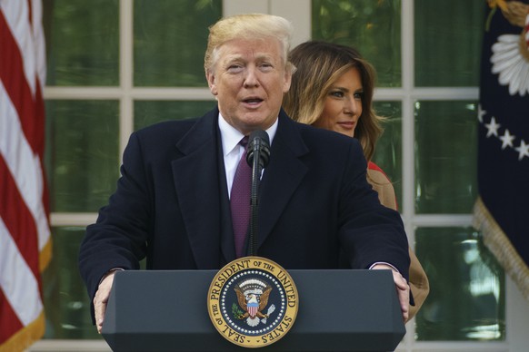 President Donald Trump and first lady Melania Trump arrive for a ceremony to pardon the National Thanksgiving Turkey in the Rose Garden of the White House in Washington, Tuesday, Nov. 20, 2018. (AP Ph ...