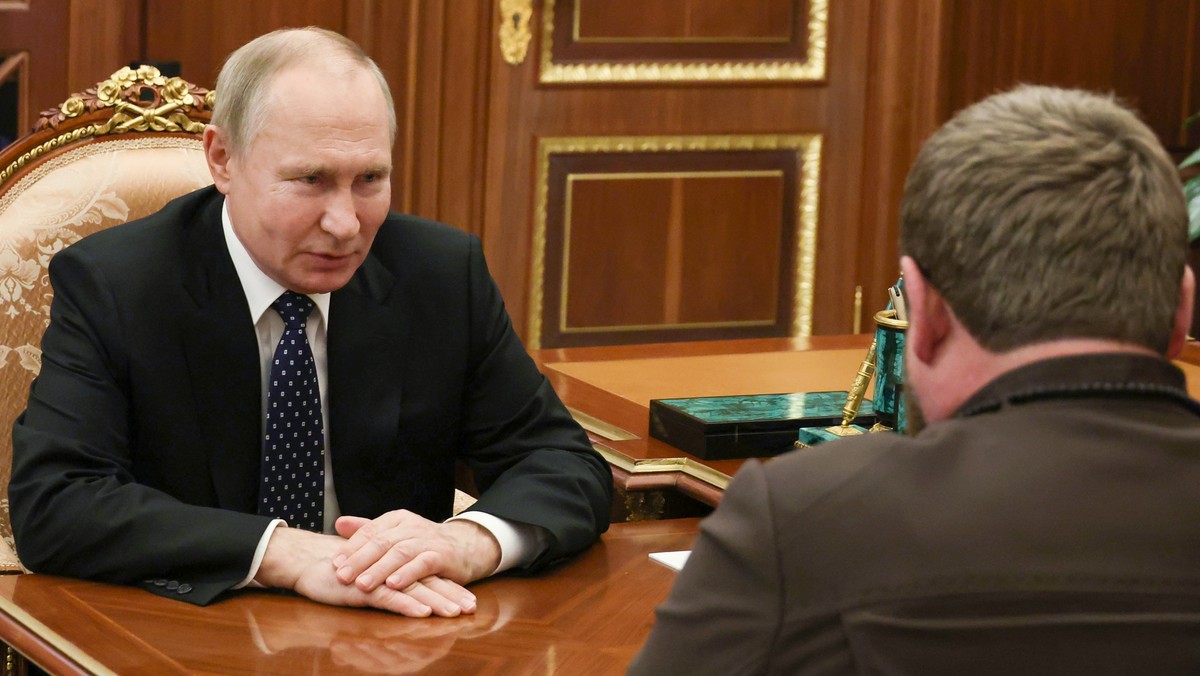Russian President Vladimir Putin listens to Chechnya's regional leader Ramzan Kadyrov, back to a camera, during their meeting at the Kremlin in Moscow, Russia, Monday, March 13, 2023. (Mikhail Kl ...
