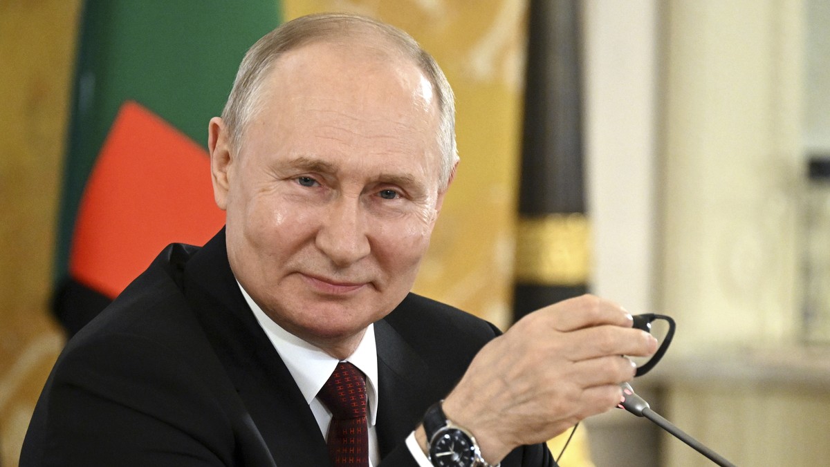 In this handout photo provided by Photo host Agency RIA Novosti, Russian President Vladimir Putin attends a meeting with a delegation of African leaders and senior officials in St. Petersburg, Russia, ...
