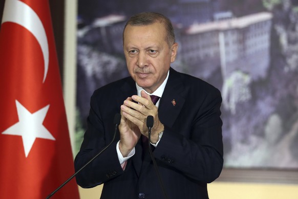 Turkey&#039;s President Recep Tayyip Erdogan applauds during a conference in Istanbul, Tuesday, July 28, 2020. Turkish lawmakers were making their final speeches Tuesday before voting on a bill that w ...