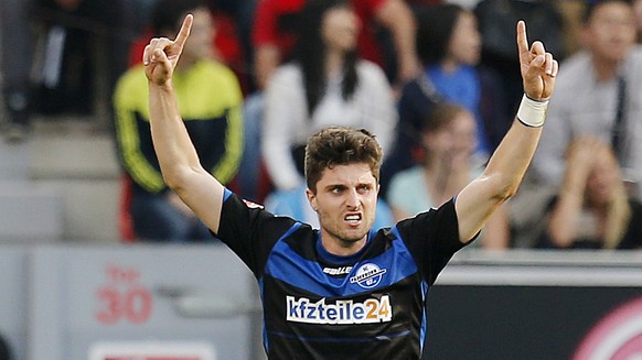 Paderborn&#039;s Moritz Stoppelkamp celebrates his side&#039;s second goal during the German first division Bundesliga soccer match between Bayer Leverkusen and SC Paderborn 07 in the BayArena stadium ...