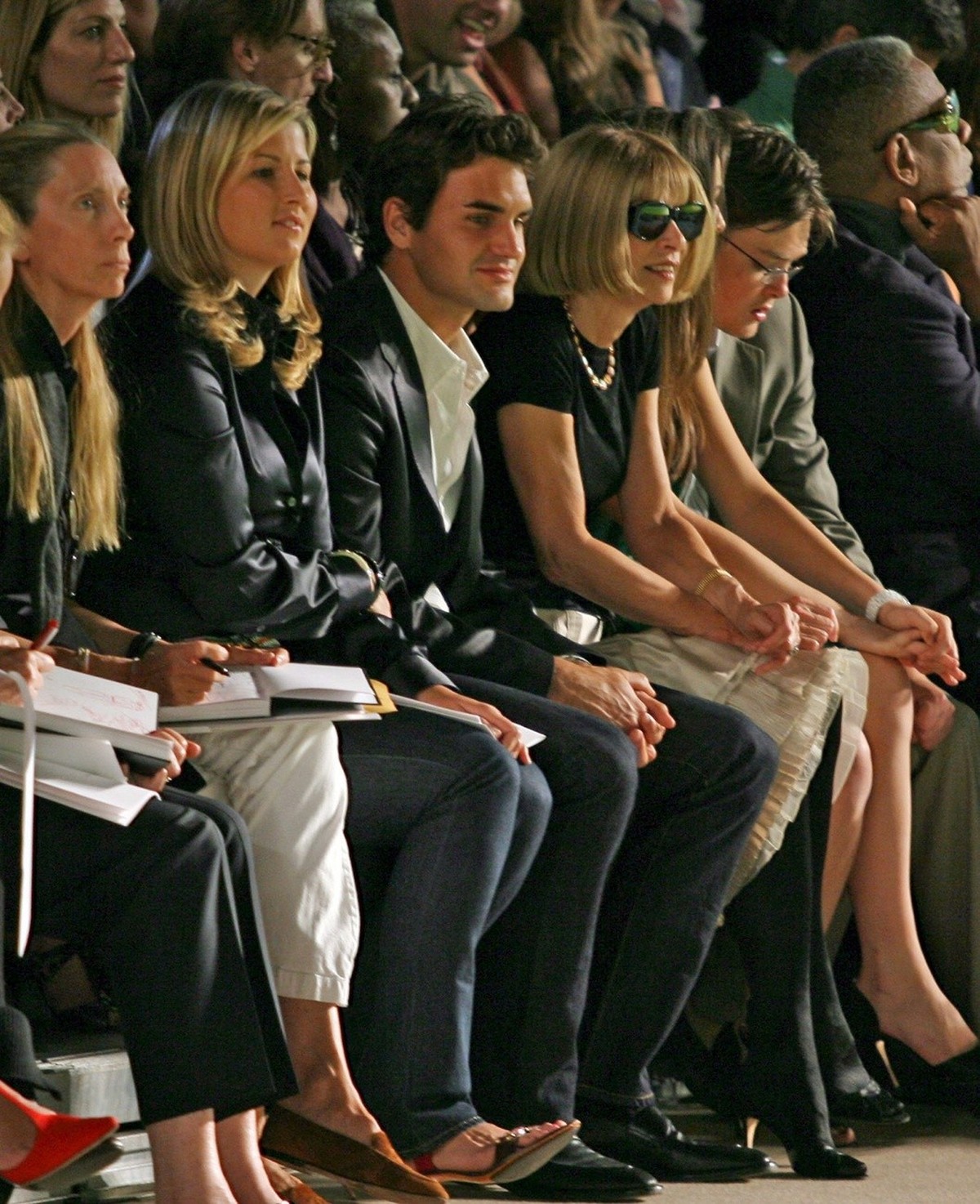 US Open Men's Tennis Champion Roger Federer (C) girlfriend Miroslava Vavrinec (L) and Vogue Editor Anna Wintour (R) watch the Spring 2007 showing of the Marc Jacobs collection during the 2006 Oly ...