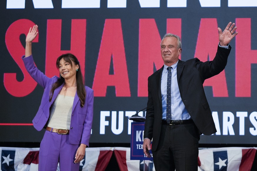 Presidential candidate Robert F. Kennedy Jr. right, waves on stage with Nicole Shanahan, after announcing her as his running mate, during a campaign event, Tuesday, March 26, 2024, in Oakland, Calif.  ...