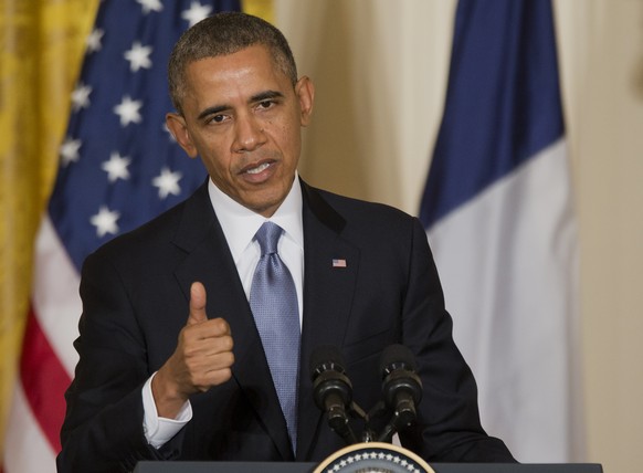 President Barack Obama gestures during a joint news conference with French President François Hollande, as part of an official state visit, Tuesday, Feb. 11, 2014, in the East Room of the White House  ...