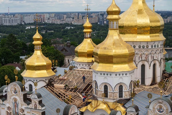 KEYPIX - Rescue workers carry out temporary repairs of the roof of the Dormition Cathedral of thousand-year-old Monastery of Caves, also known as Kyiv Pechersk Lavra, damaged after a Russian strike in ...